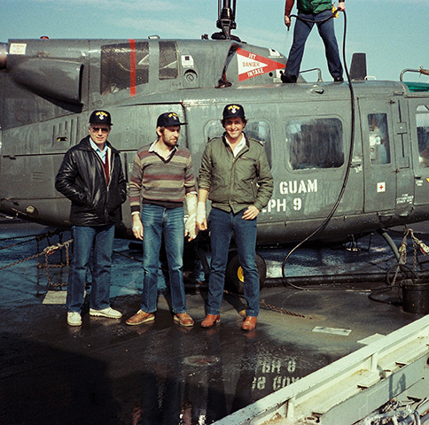 Alan Florence (sound), Ted Henley (cameraman) and Brent Sadler (reporter) on the flight deck of the USS Guam after being evacuated from Beirut in 1983 after Henley and Sadler were hit by fragments of .50 calibre machine gun fire
