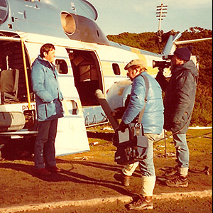 Downed Argentine helicopter in Port Stanley, Falkland Islands. Sadler with ITN cameraman Mike Borer and soundman Mike Williams