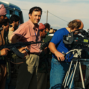 Brent Sadler and ITN cameraman Andy Rex with Kurdish Peshmerga fighters in Northern Iraq, 1991